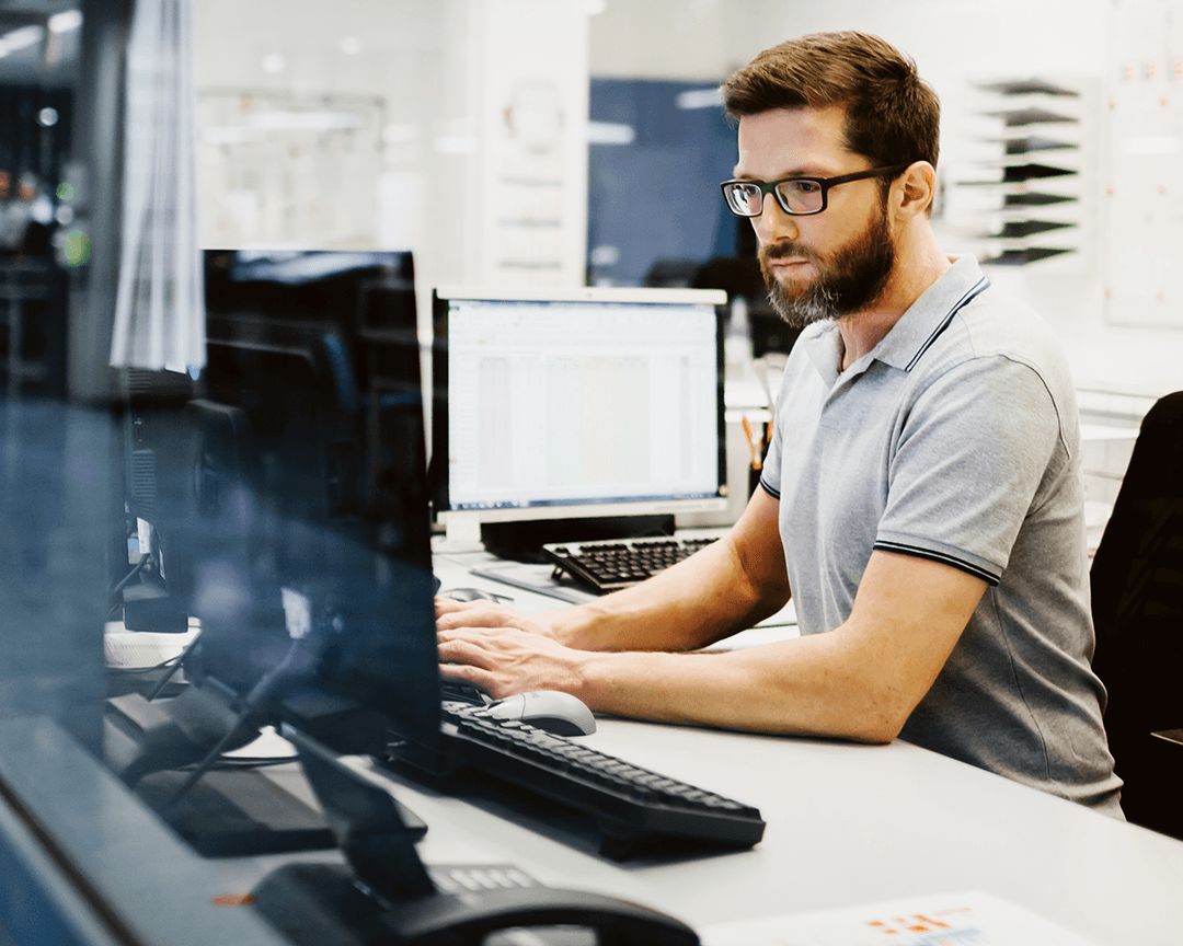 Decision point man looking at monitor
